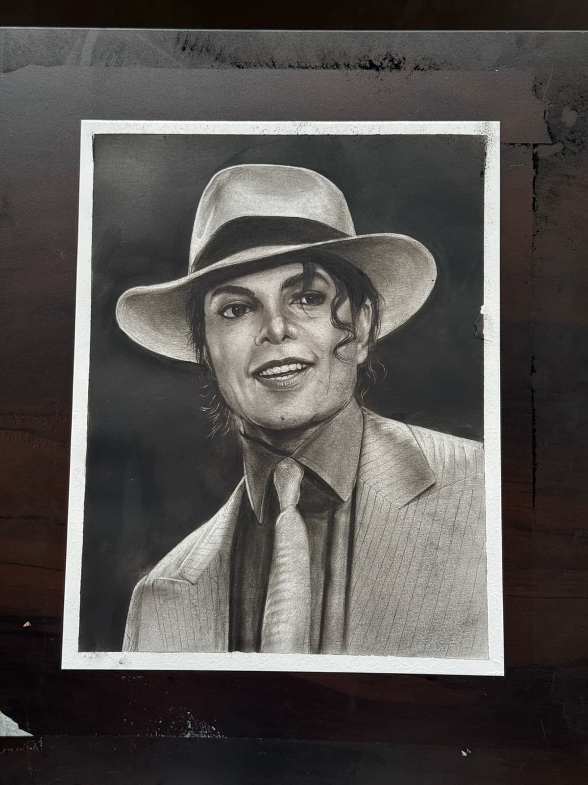 Finished charcoal portrait study of Michael Jackson in a fedora hat
